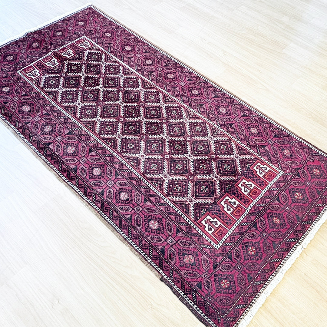 トライバルラグ<br>イラン産 バルーチ<br>リビングサイズ 224×116
