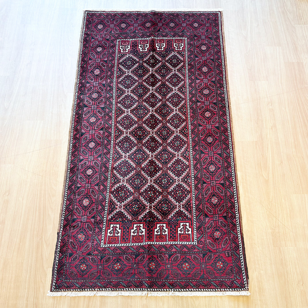 トライバルラグ<br>イラン産 バルーチ<br>リビングサイズ 224×116