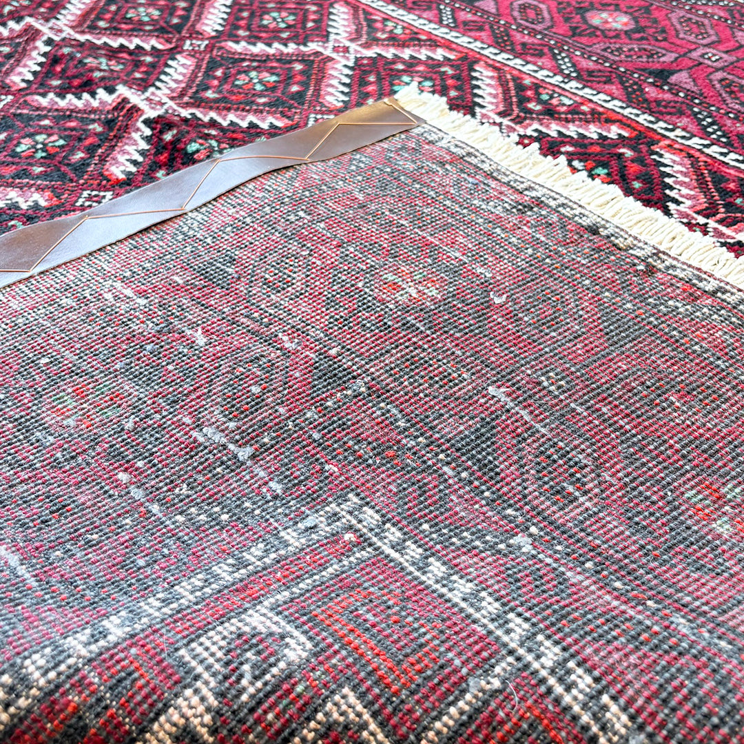 トライバルラグ<br>イラン産 バルーチ<br>リビングサイズ 224×116