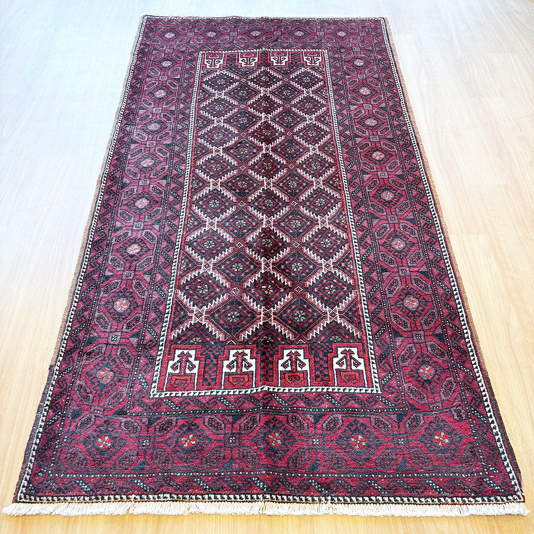 トライバルラグ<br>イラン産 バルーチ<br>リビングサイズ 224×116
