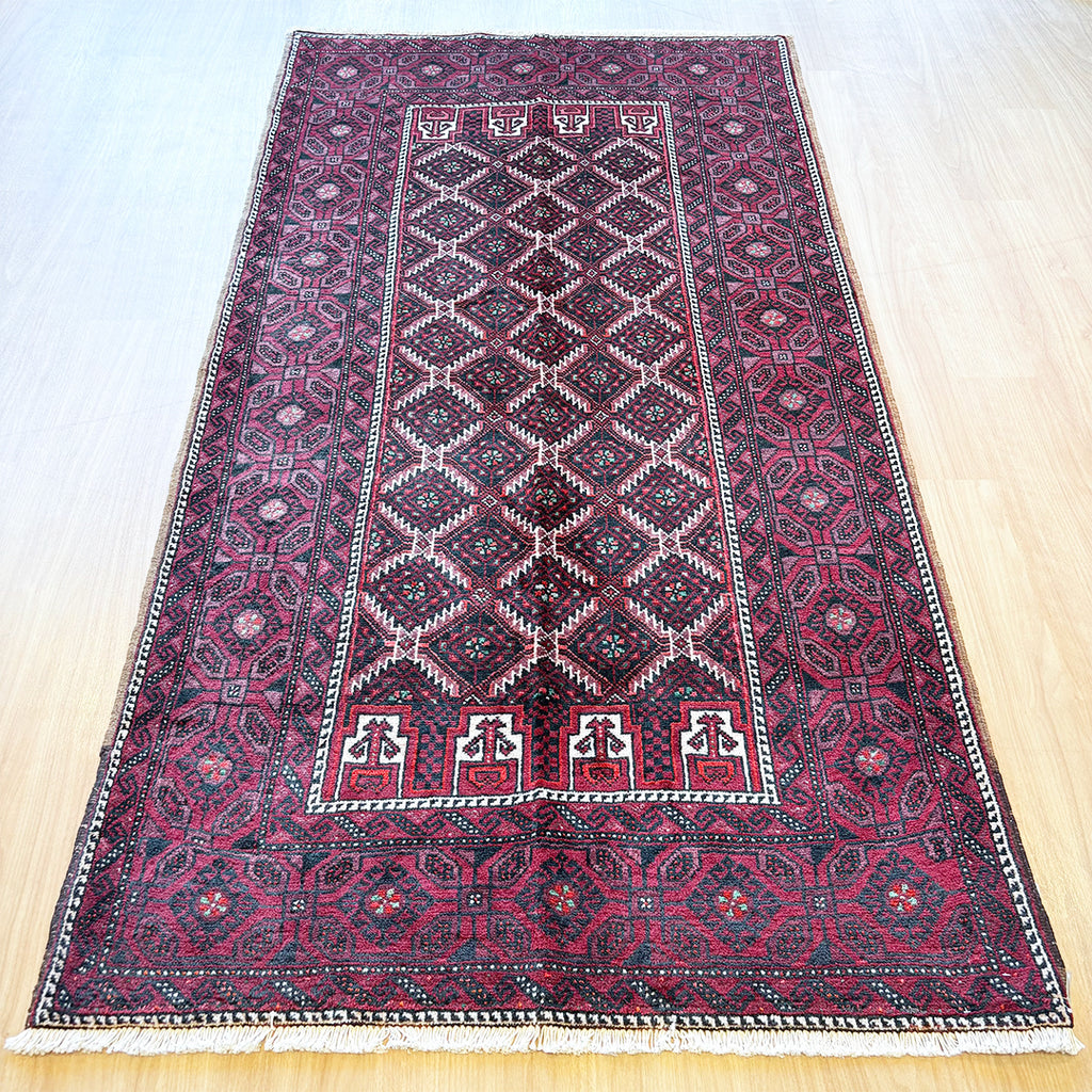 トライバルラグ<br>イラン産 バルーチ<br>リビングサイズ 224×116
